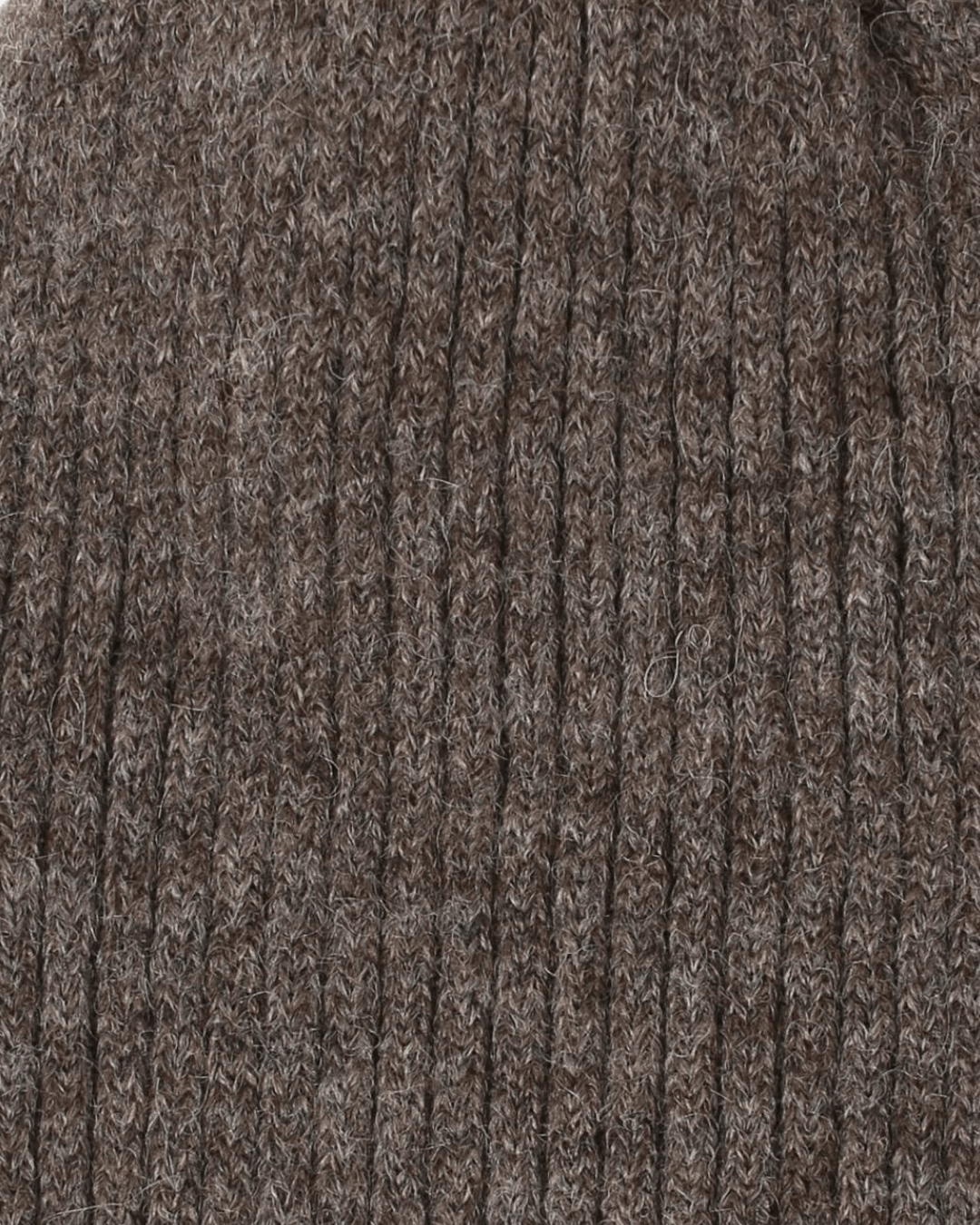 Close-up of the Belacaro kids beanie in brown baby alpaca, showing the soft ribbed knit texture.