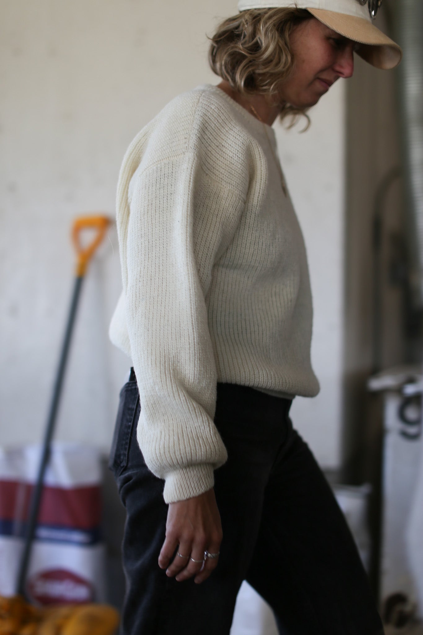 Off-white Beaurivage sweater worn by the farmer who produced this wool, walking