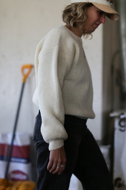 Off-white Beaurivage sweater worn by the farmer who produced this wool, walking