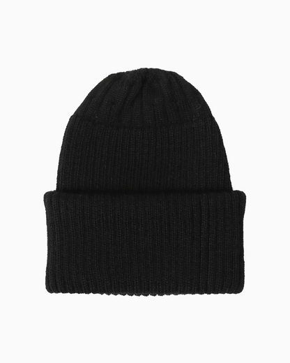 A ribbed alpaca knit beanie hat in a black color, shown flat against a solid white background.