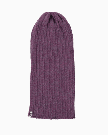 A ribbed alpaca knit beanie hat unrolled in a purple color, shown flat against a solid white background.
