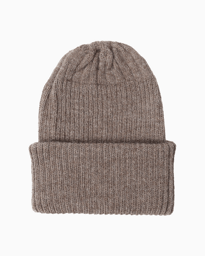 A ribbed alpaca knit beanie hat in a taupe color, shown flat against a solid white background.