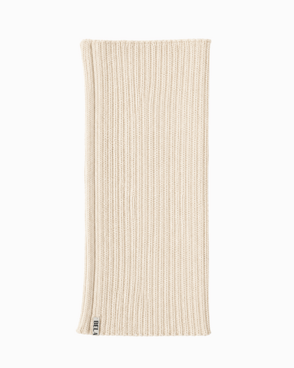 packshot of an cream alpaca knitted neck warmer against a white background