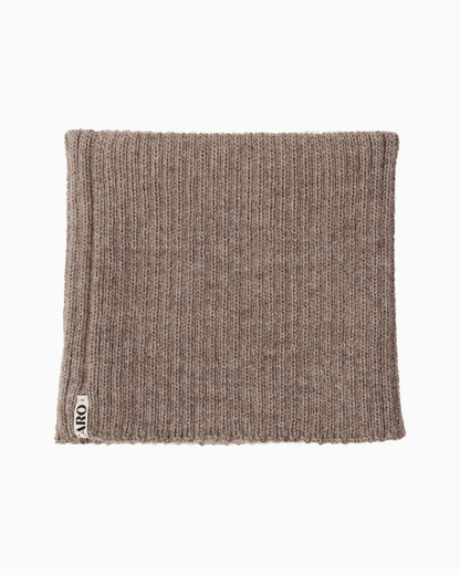 packshot of a folded taupe alpaca knitted neck warmer against a white background