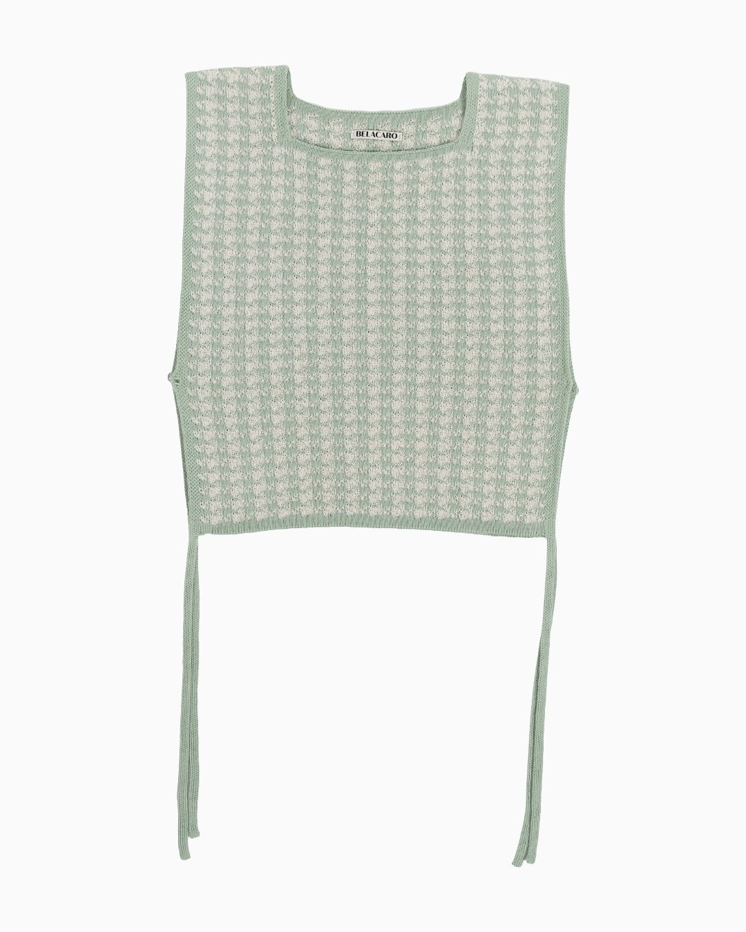 Green and white houndstooth knitted top on a white background