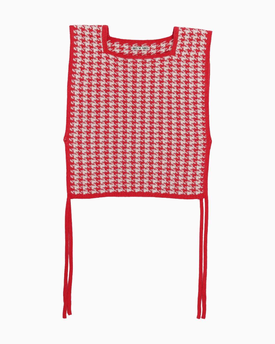 Red and white houndstooth patterned top on a white background