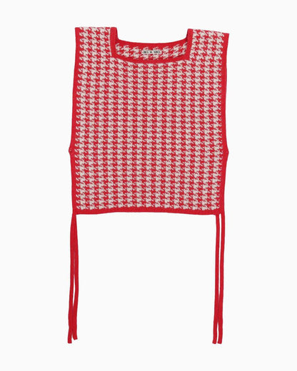 Red and white houndstooth patterned top on a white background