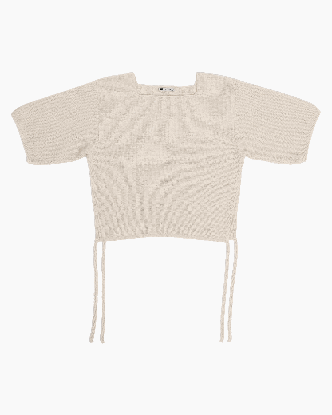 Beige belacaro baby alpaca knit top with short sleeves and drawcord ties, flat lay on white background.