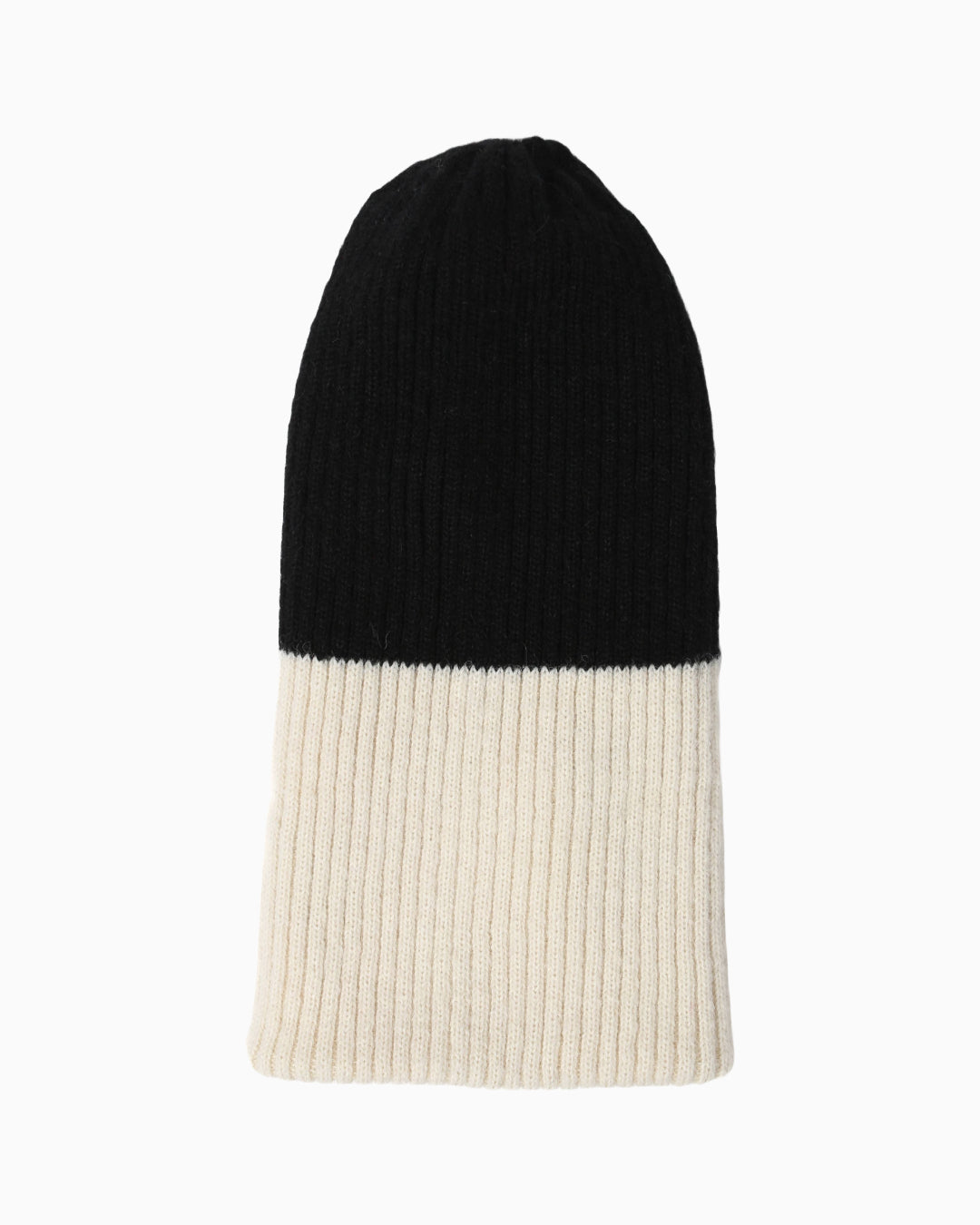 Belacaro beanie in black and cream baby alpaca, half-and-half ribbed knit design, flat lay on white background.