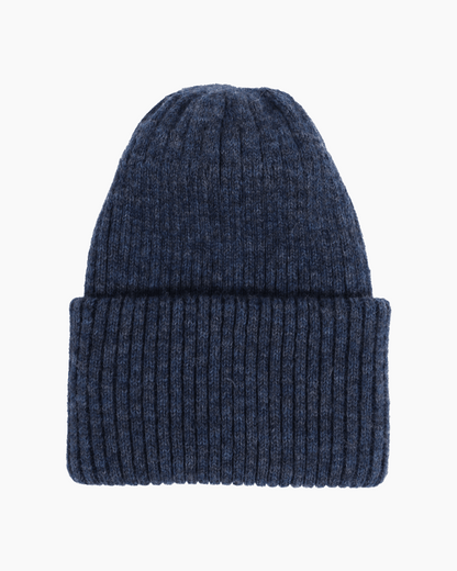 Belacaro beanie in navy baby alpaca, ribbed knit with folded brim, flat lay on white background.
