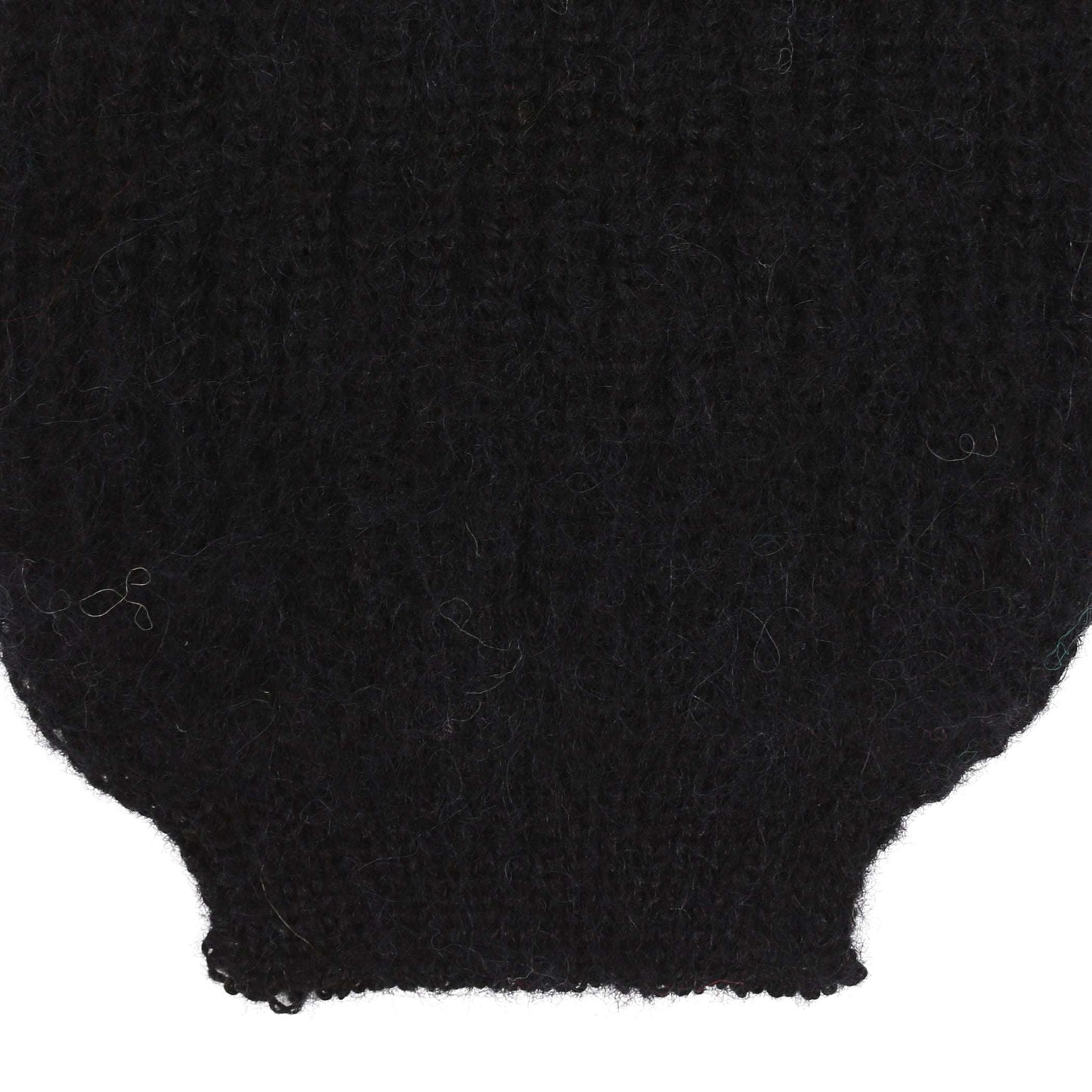 the sleeve detail of an alpaca ribbed knit black sleeve