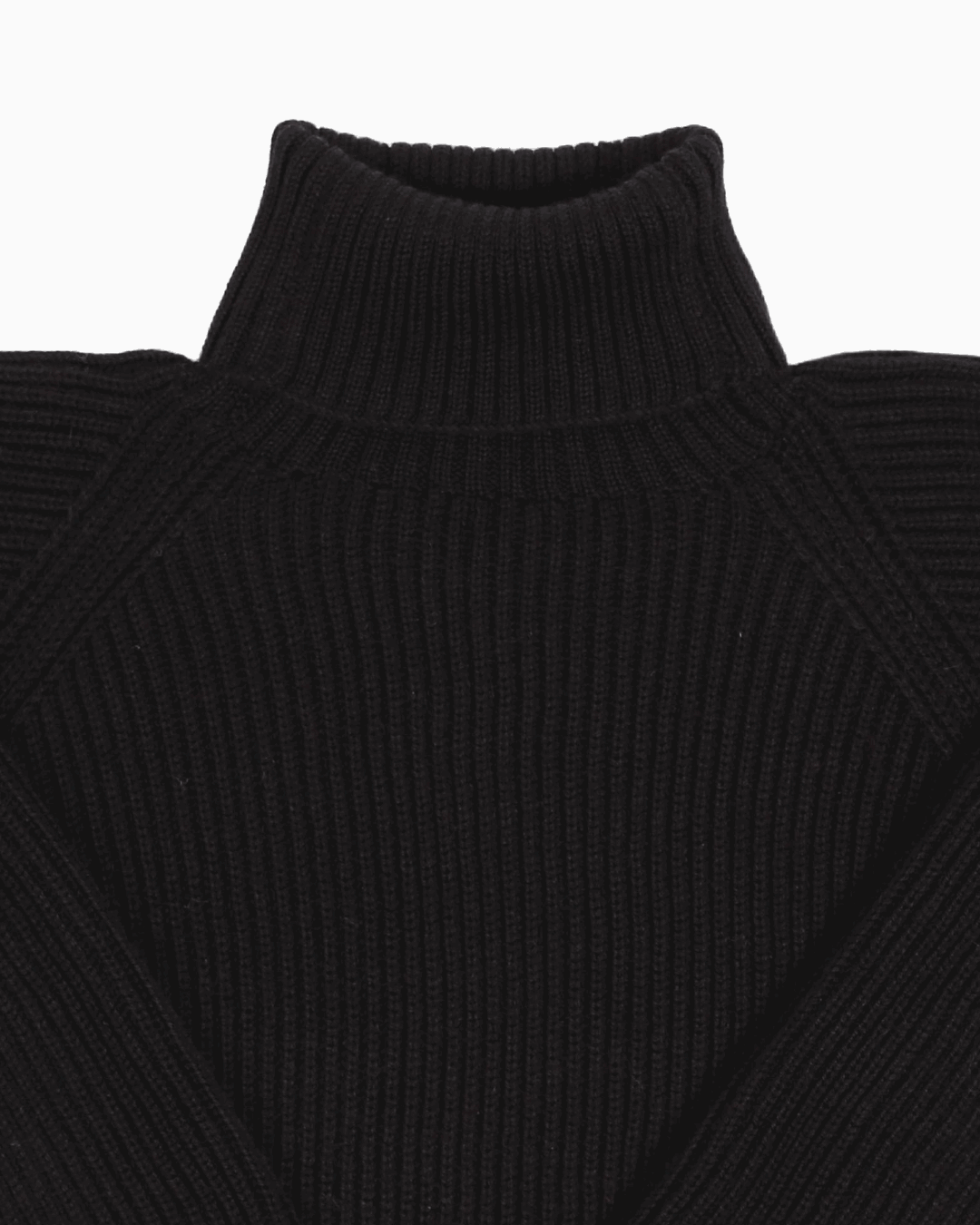 Collar detail of a black unisex turtleneck sweater made of baby alpaca wool with a fisherman rib design.