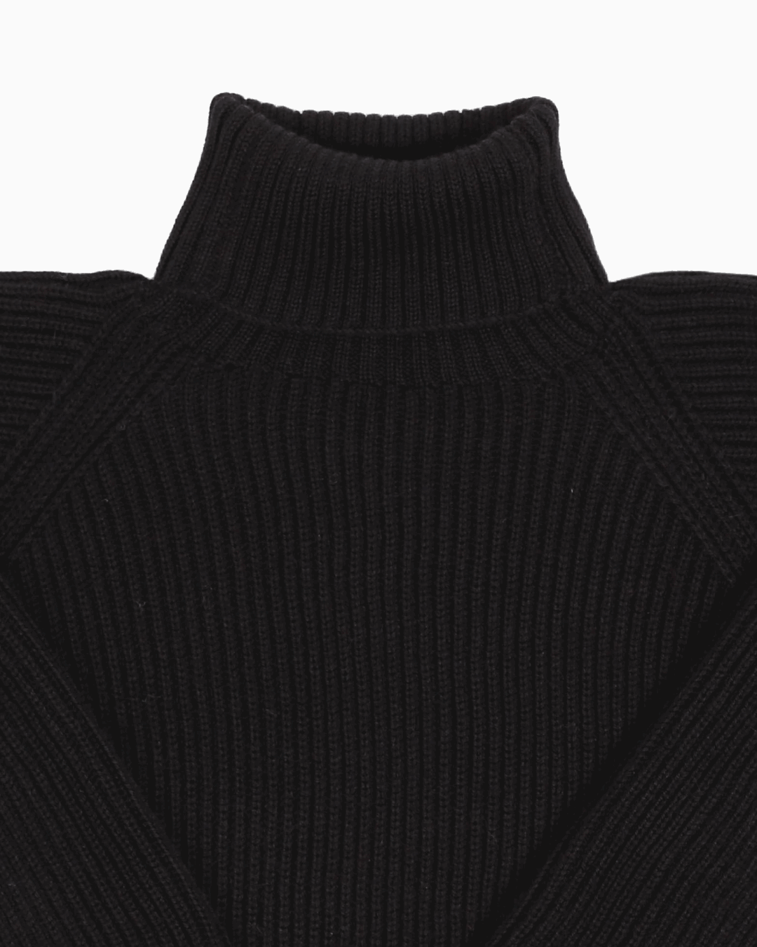 Collar detail of a black unisex turtleneck sweater made of baby alpaca wool with a fisherman rib design.