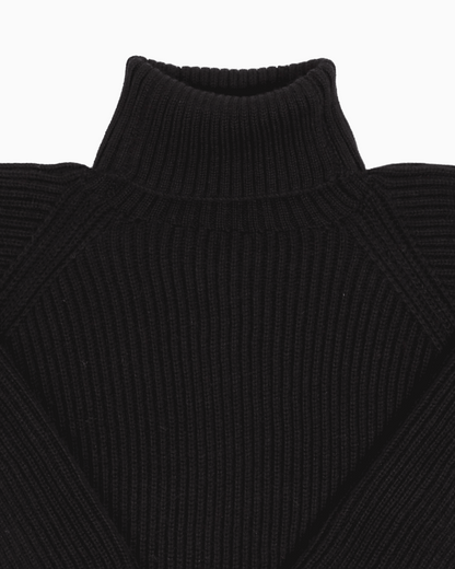Collar detail of a black unisex turtleneck sweater made of baby alpaca wool with a fisherman rib design.