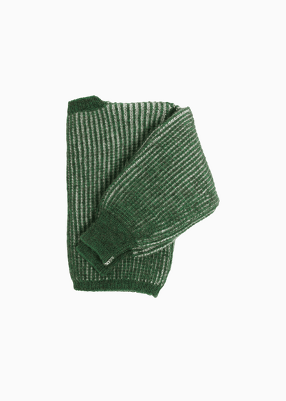 A bicolor green and white junior cardigan with a ribbed texture, 3 buttons down the front, folded