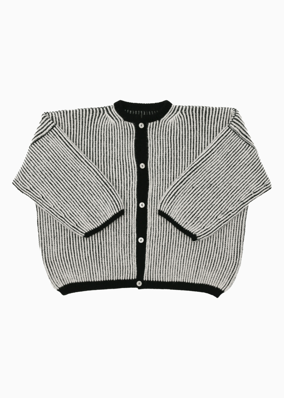 A bicolor black and white oversize cardigan with a ribbed texture, 3 buttons down the front bicolor oversized and wide 3/4 sleeves