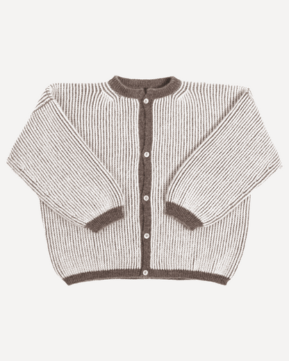 A bicolor brown and white oversize cardigan with a ribbed texture, 3 buttons down the front bicolor oversized and wide 3/4 sleeves