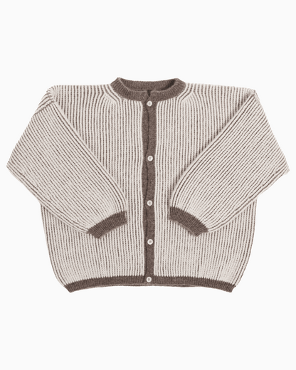 A bicolor brown and white oversize cardigan with a ribbed texture, 3 buttons down the front bicolor oversized and wide 3/4 sleeves