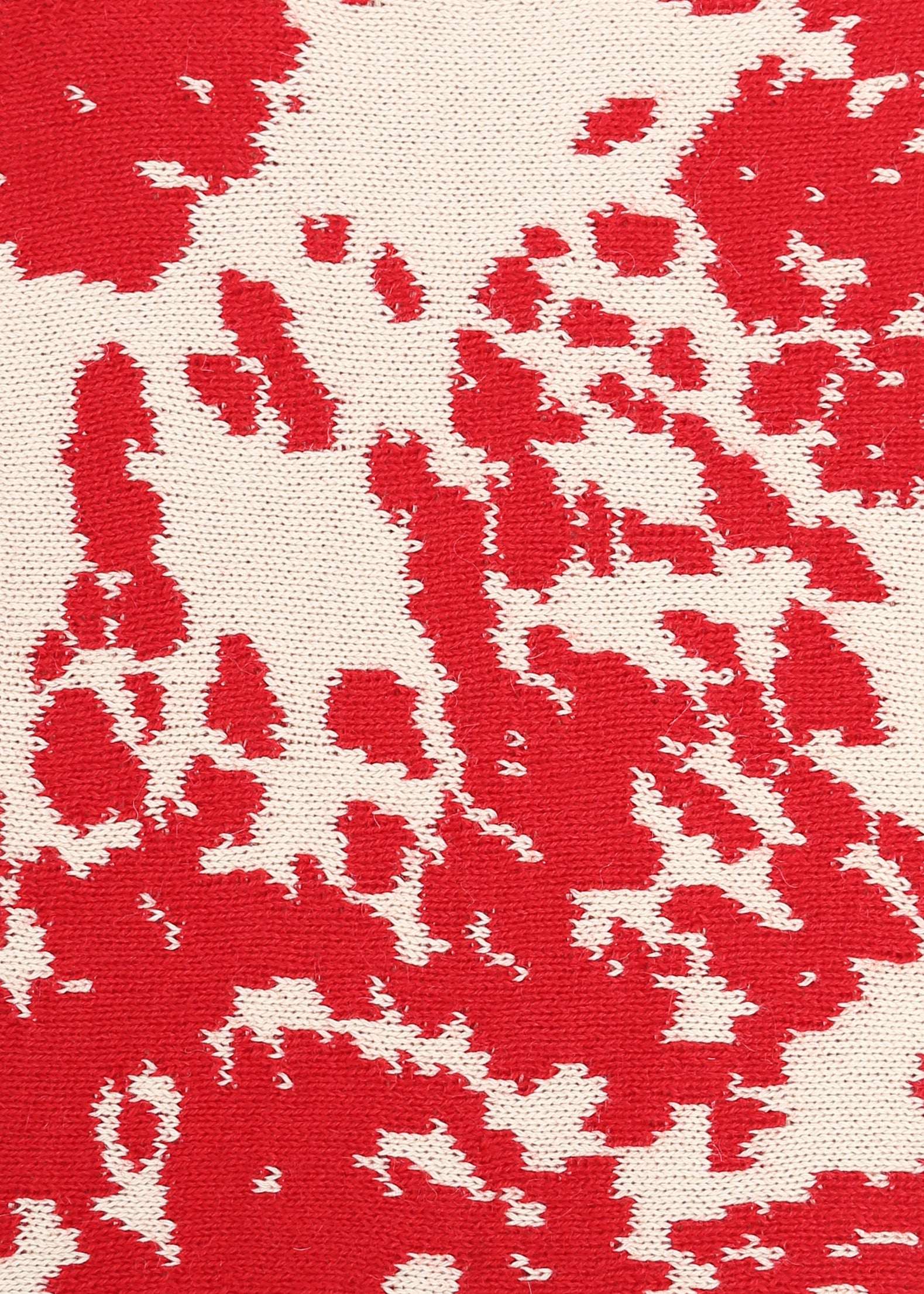 Red and cream cow patterned knit