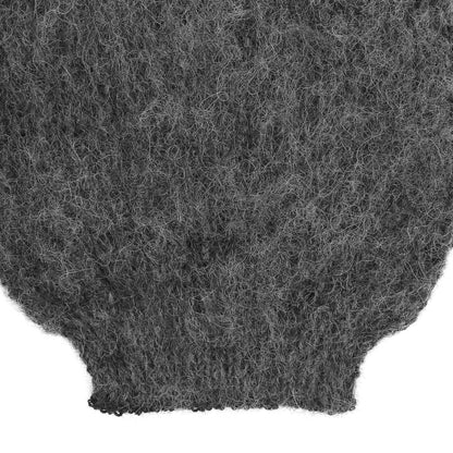 the sleeve detail of an alpaca ribbed knit grey sleeve