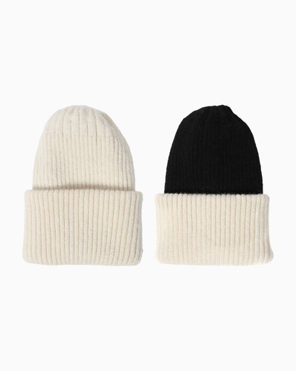 Belacaro kids beanies in cream and black baby alpaca, ribbed knit with folded brims, flat lay on white background.