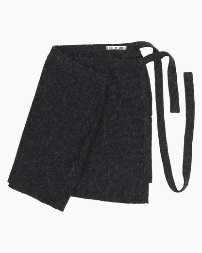 Packshot of a grey knit pareo skirt over a white background