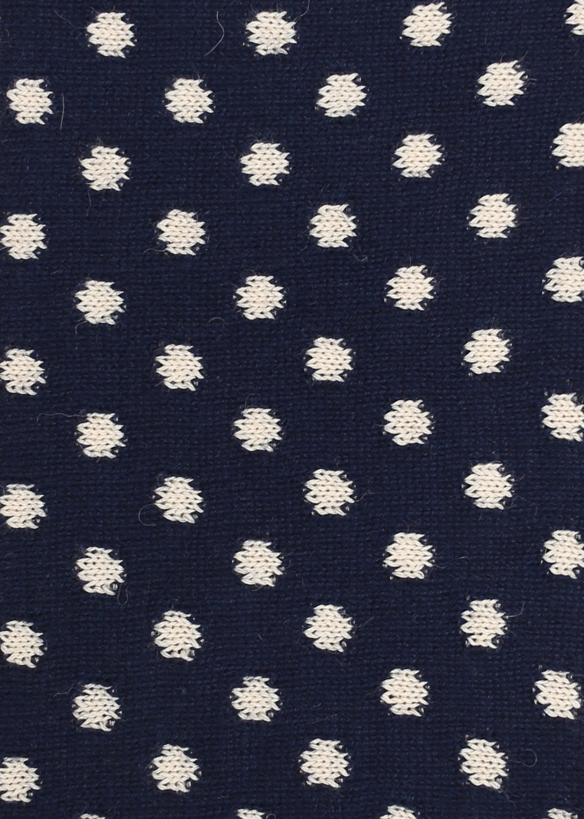 Navy blue knitted fabric with white polka dots