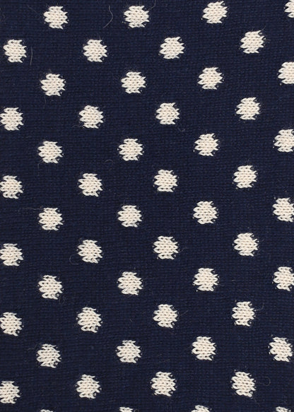 Navy blue knitted fabric with white polka dots