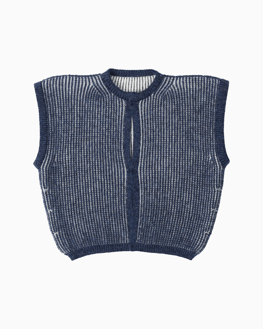 A navy and white reversible vest with heavy english rib knits on a white background