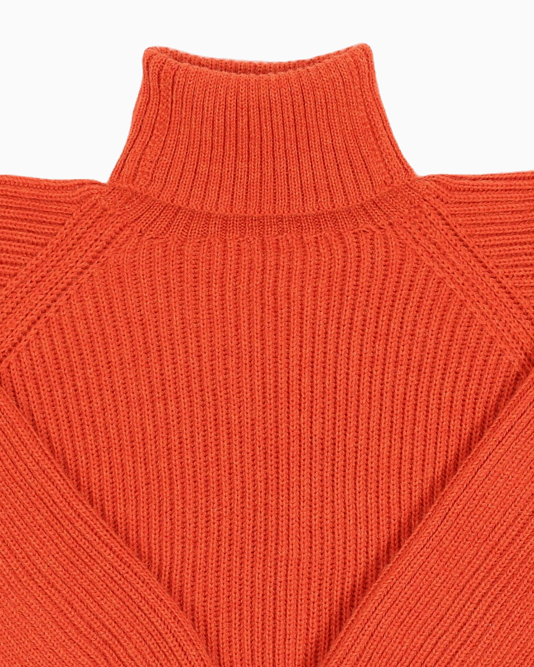 Collar detail of an orange unisex turtleneck sweater made of baby alpaca wool with a fisherman rib design.