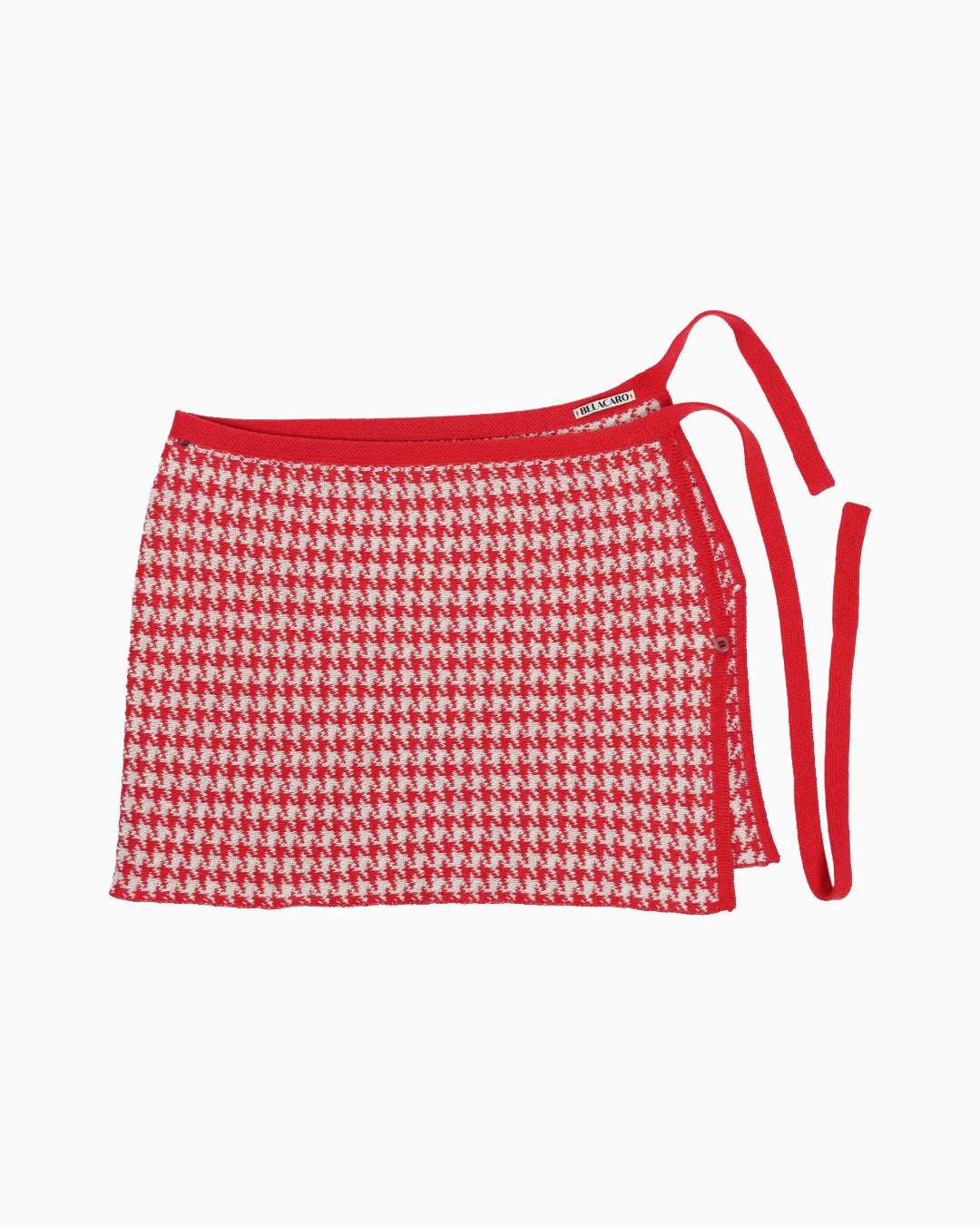 Red and white houndtooth knitted pareo skirt on a white background