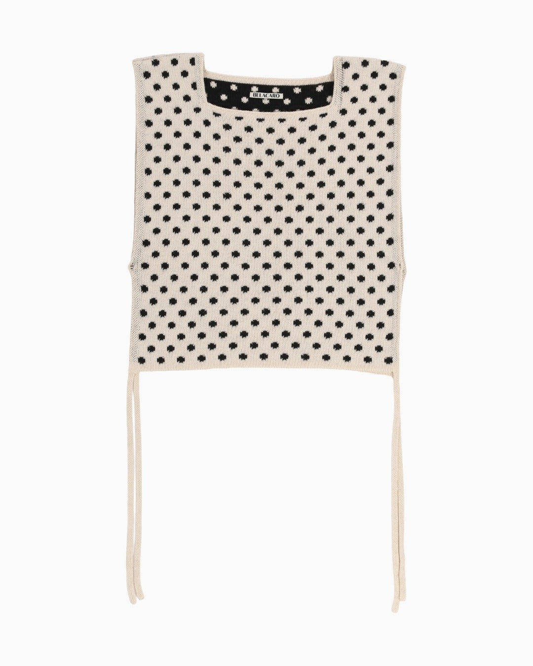 Light polka dot apron top with white trim on a white background