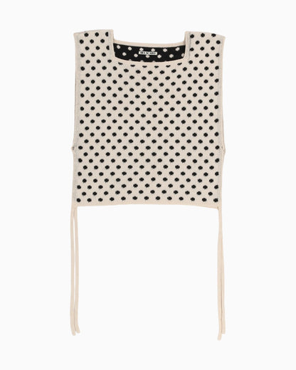 Light polka dot apron top with white trim on a white background