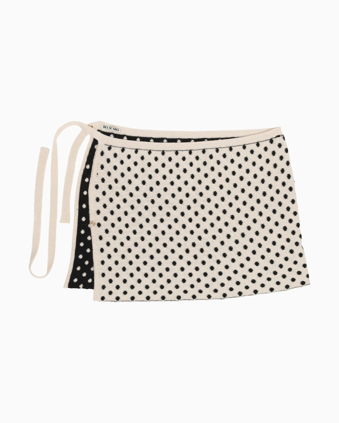 White reversible skirt with polka dots, packshot on a white background