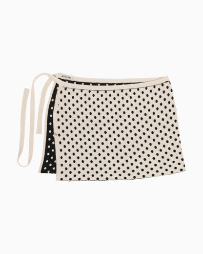 White reversible skirt with polka dots, packshot on a white background