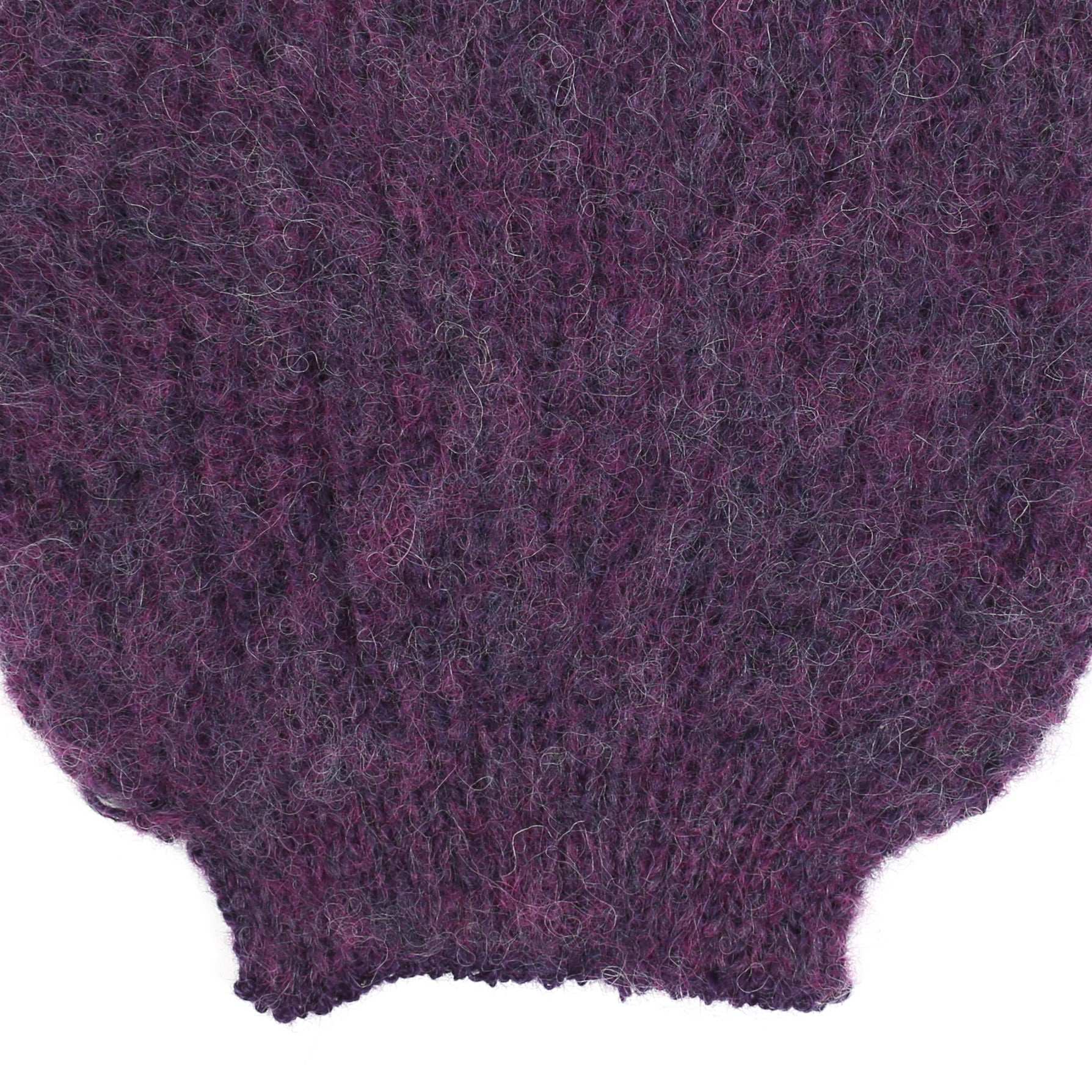 the sleeve detail of an alpaca knit purple sleeve