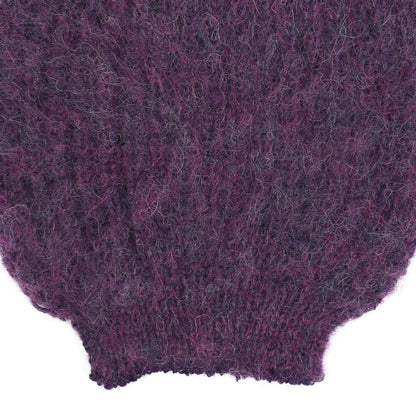 the sleeve detail of an alpaca knit purple sleeve