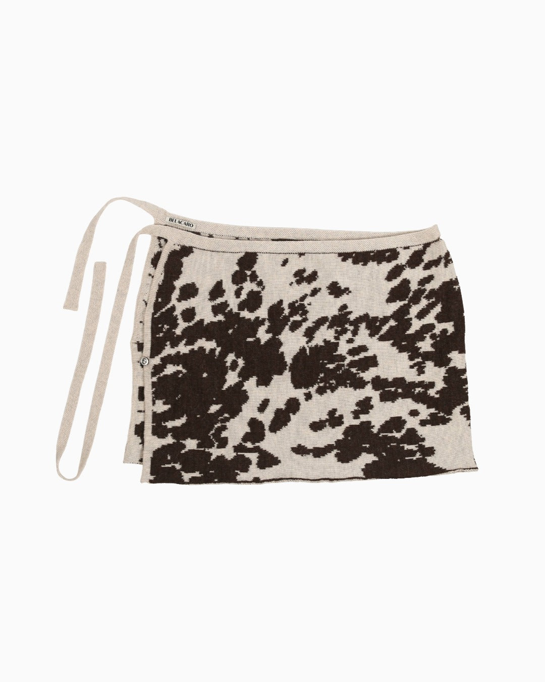 Black and white cow patterned skirt with white background