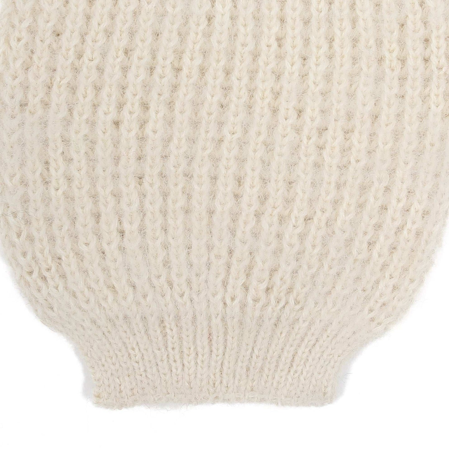 the sleeve detail of an alpaca ribbed knit white sleeve