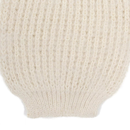 the sleeve detail of an alpaca ribbed knit white sleeve