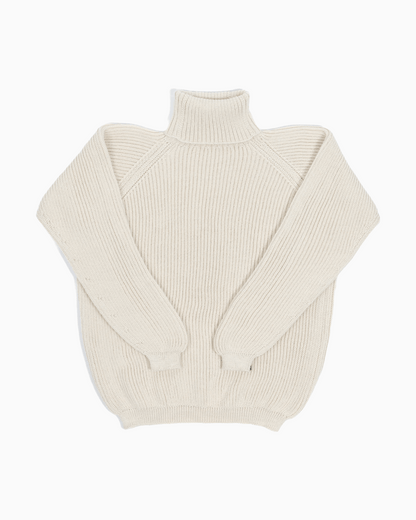 Packshot of a white unisex turtleneck sweater made of baby alpaca wool with a fisherman rib design.